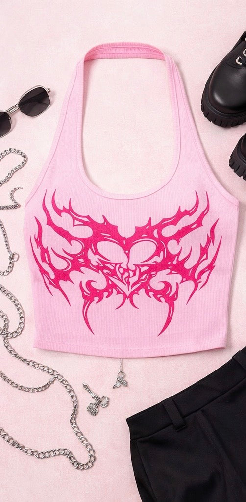 Pink tank top with tribal design on a light pink background with accessories.