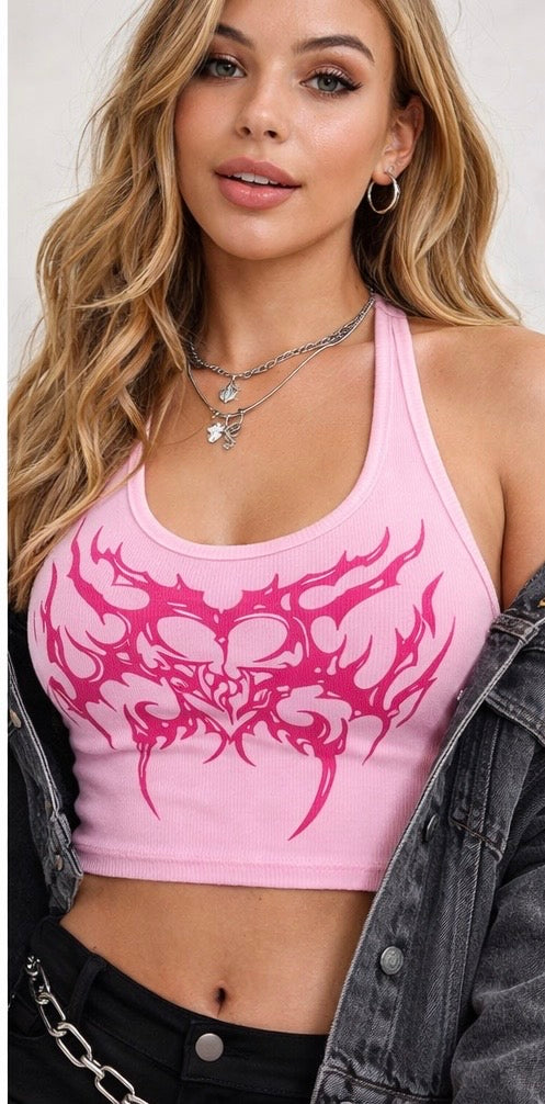 Woman wearing a pink crop top with a dragon design against a white background