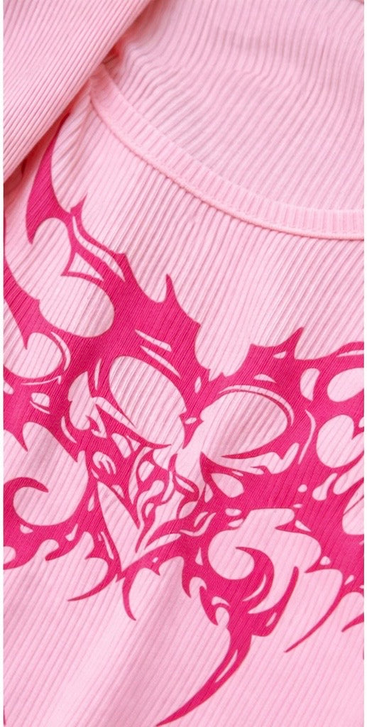Pink fabric with a white tribal pattern