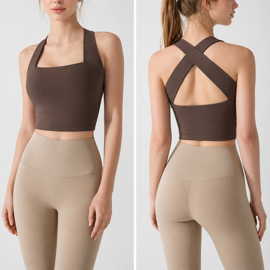 Woman wearing a brown sports bra and beige leggings on a white background