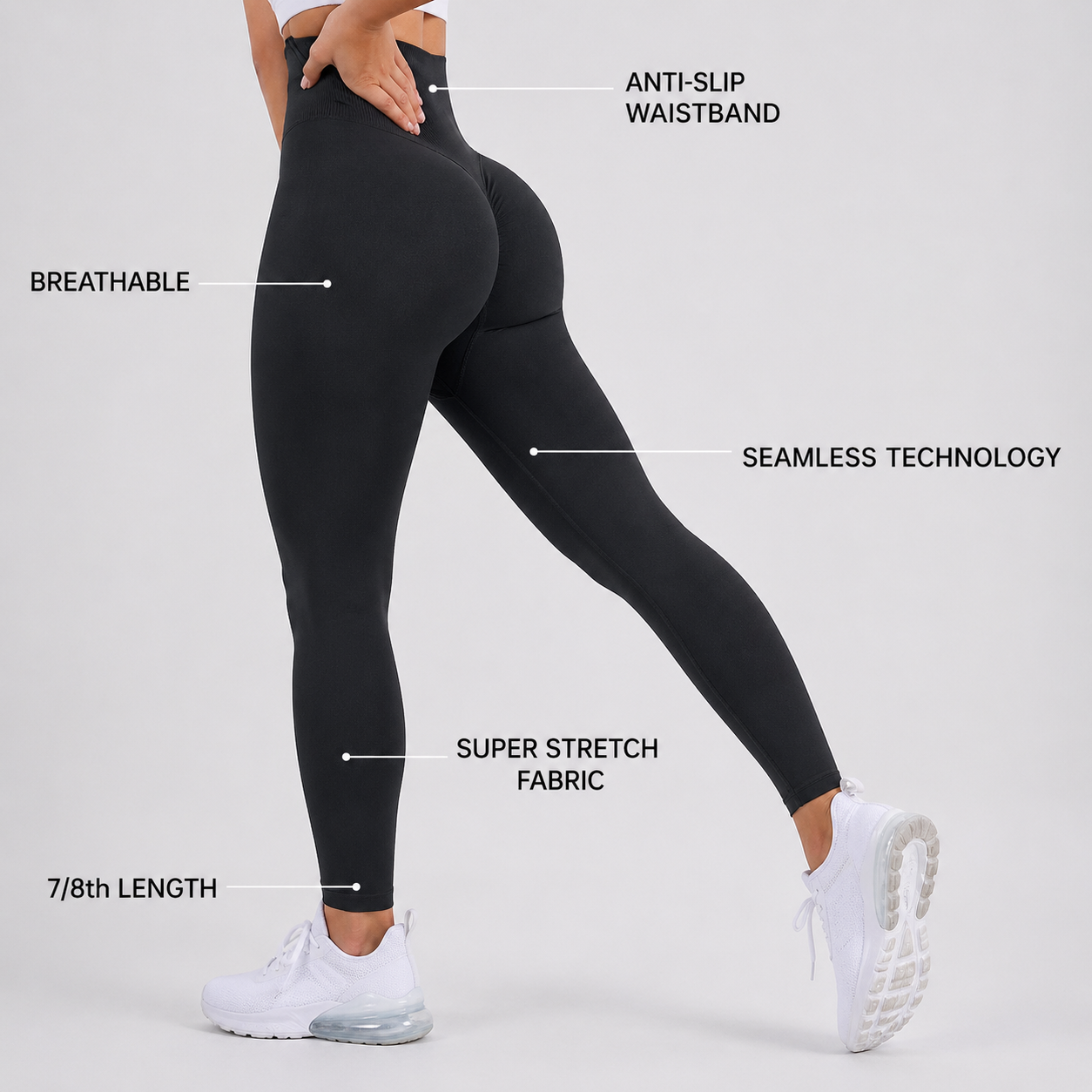 Black leggings with text labels on a gray background