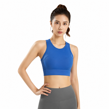 Woman wearing a blue sports bra and gray leggings on a white background