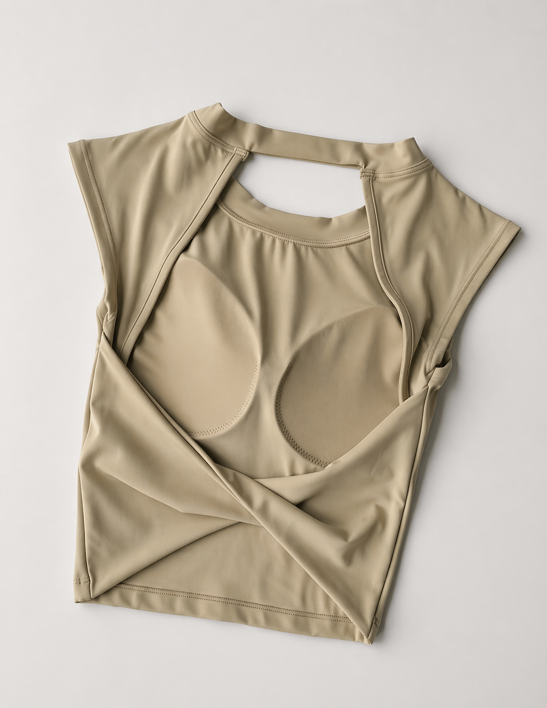 Beige sleeveless top on a light gray background