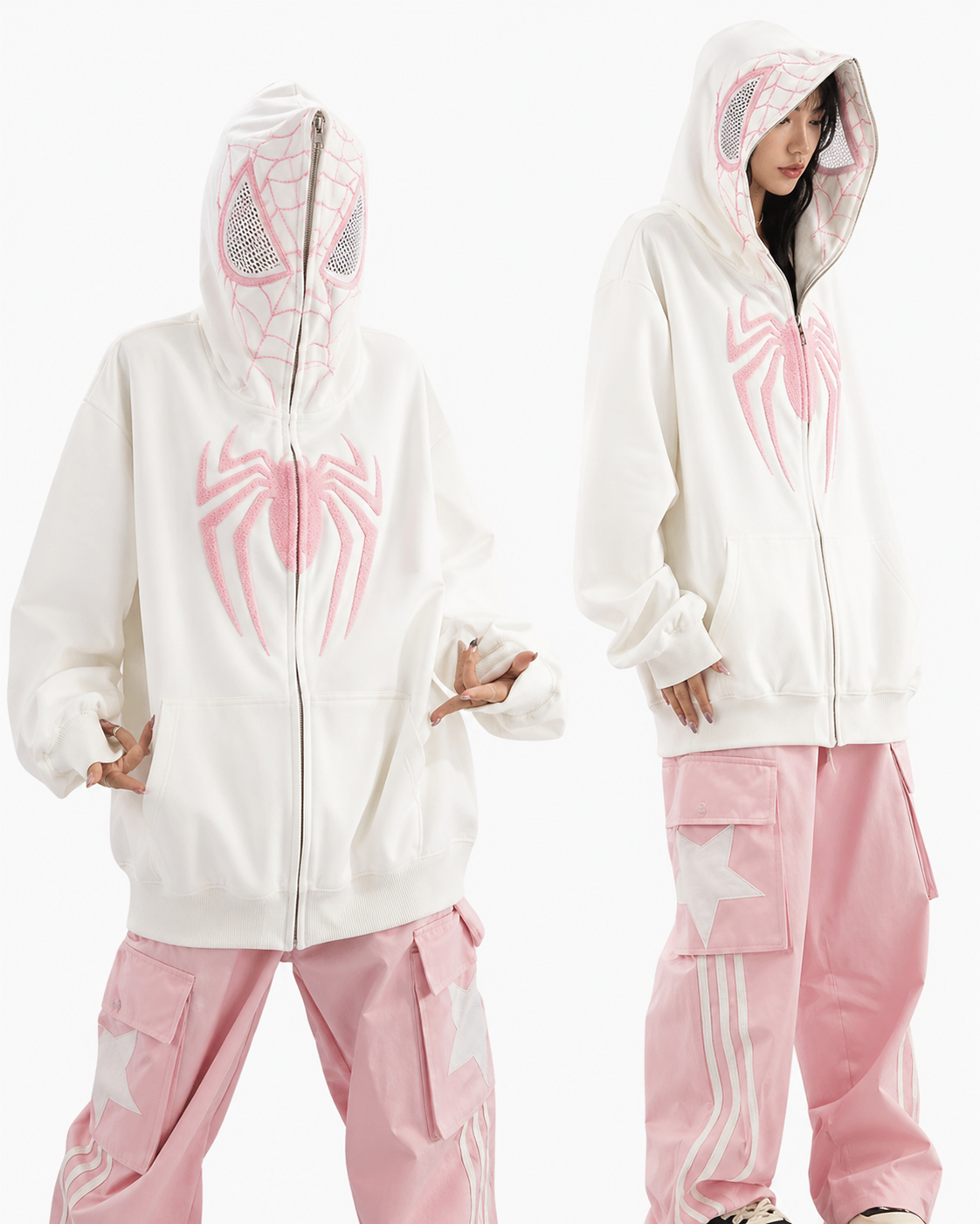 Two people wearing matching white and pink hoodies and pants on a white background
