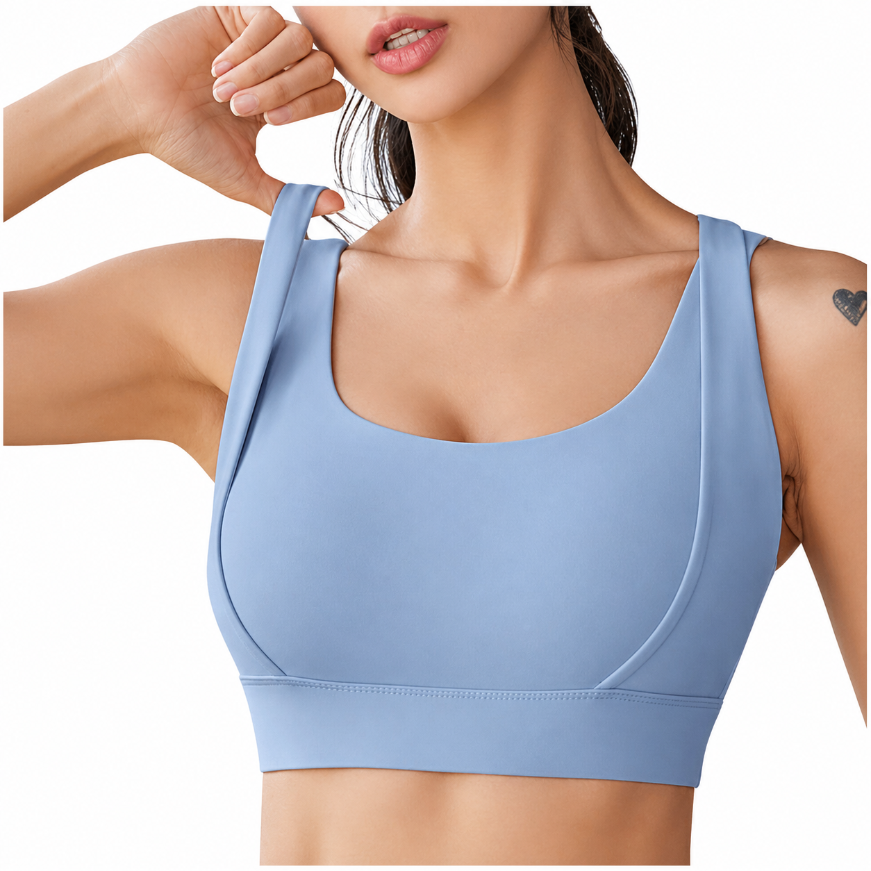 Light blue sports bra worn by a model on a white background