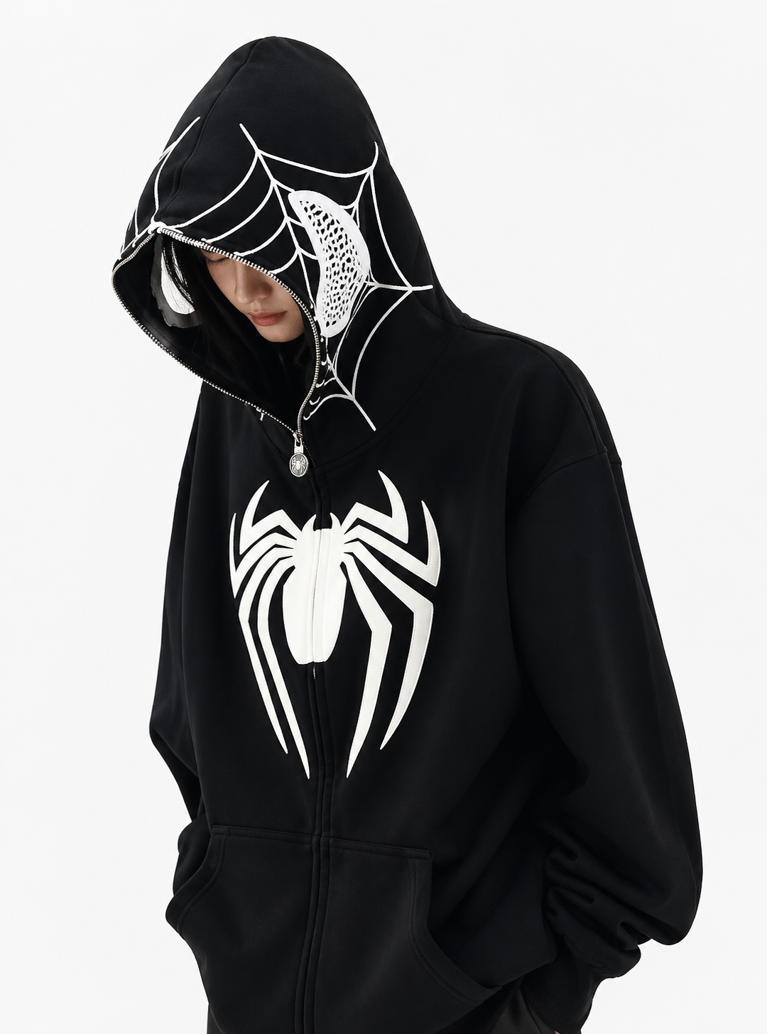 Black hoodie with white spider design on a plain background