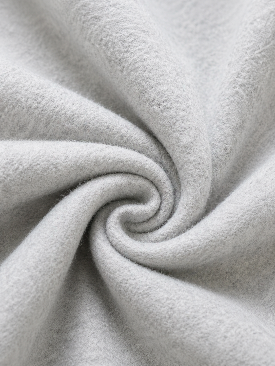 Close-up of gray fabric with a swirl pattern