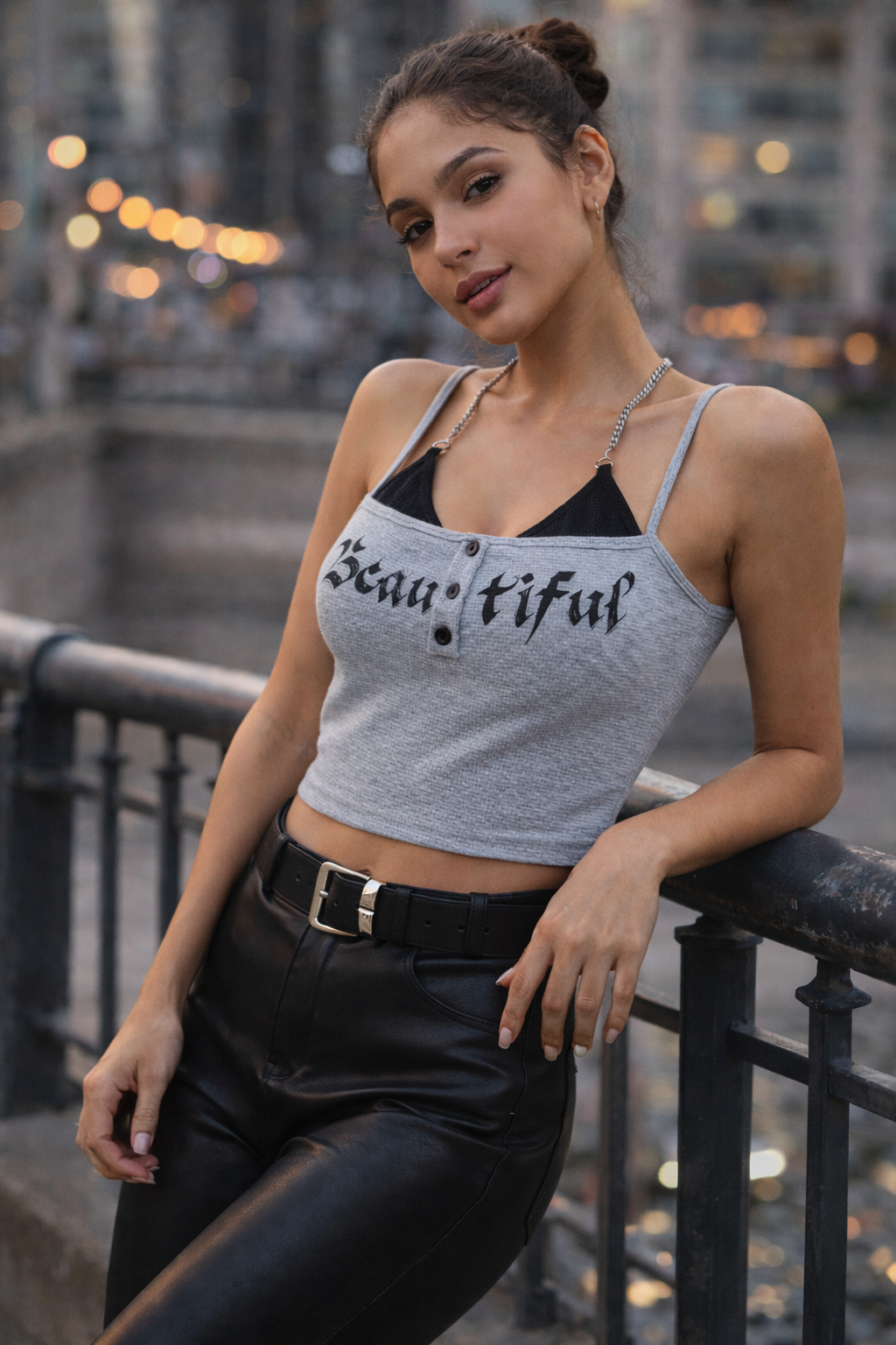 Woman wearing a tank top with the word 'Beautiful' in an urban setting