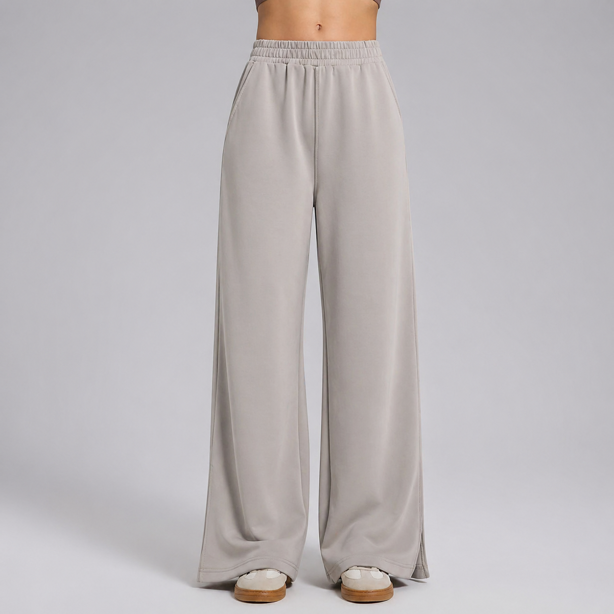 Light gray wide-leg pants on a plain background