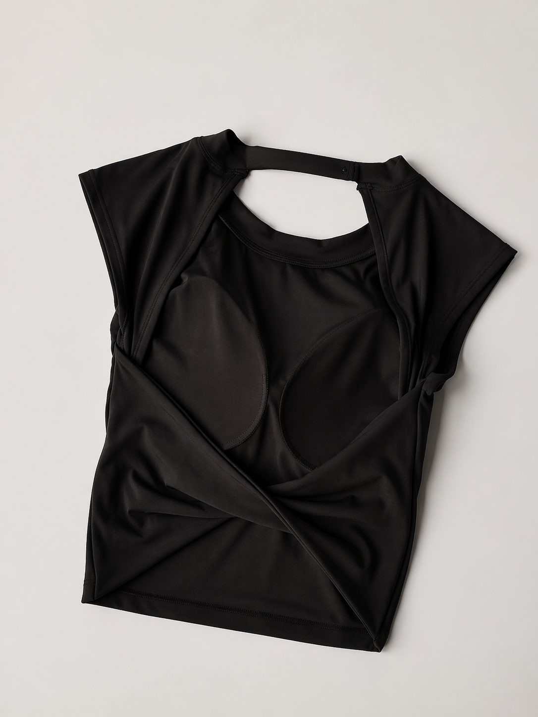 Black top with a knot detail on a light gray background