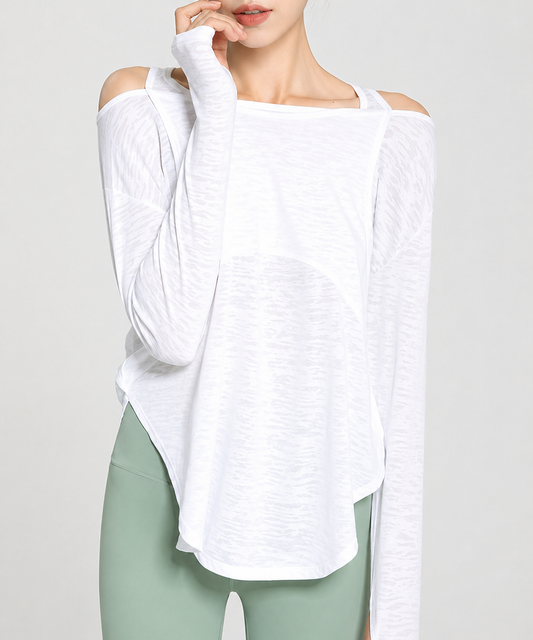 Person wearing a white off-shoulder top and green leggings on a light gray background