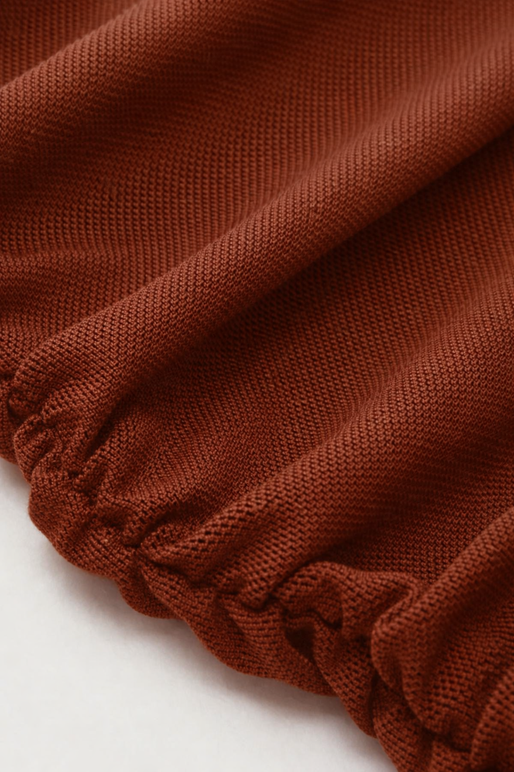 Close-up of brown fabric with a white background