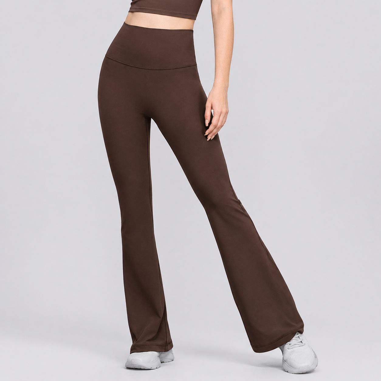 Brown leggings worn by a person on a light gray background