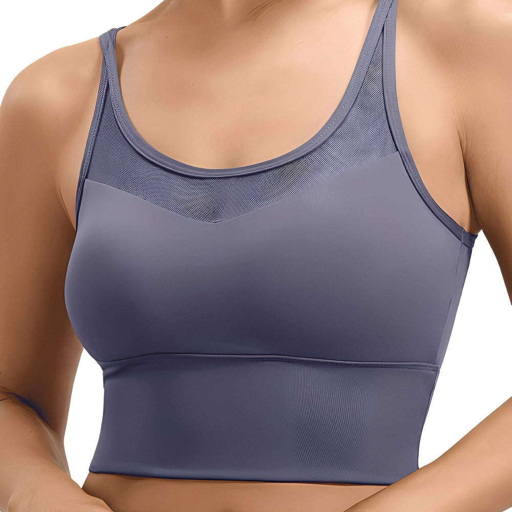 Blue sports bra worn by a person on a white background